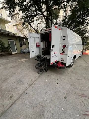 Magnet Plumbing service vehicle on-site for Grease Trap Cleaning in Juanamaria